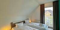 Schlafzimmer mit Balkonzugang