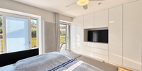 Schlafzimmer mit Zugang zur Terrasse