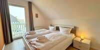 Schlafzimmer mit Balkonzugang